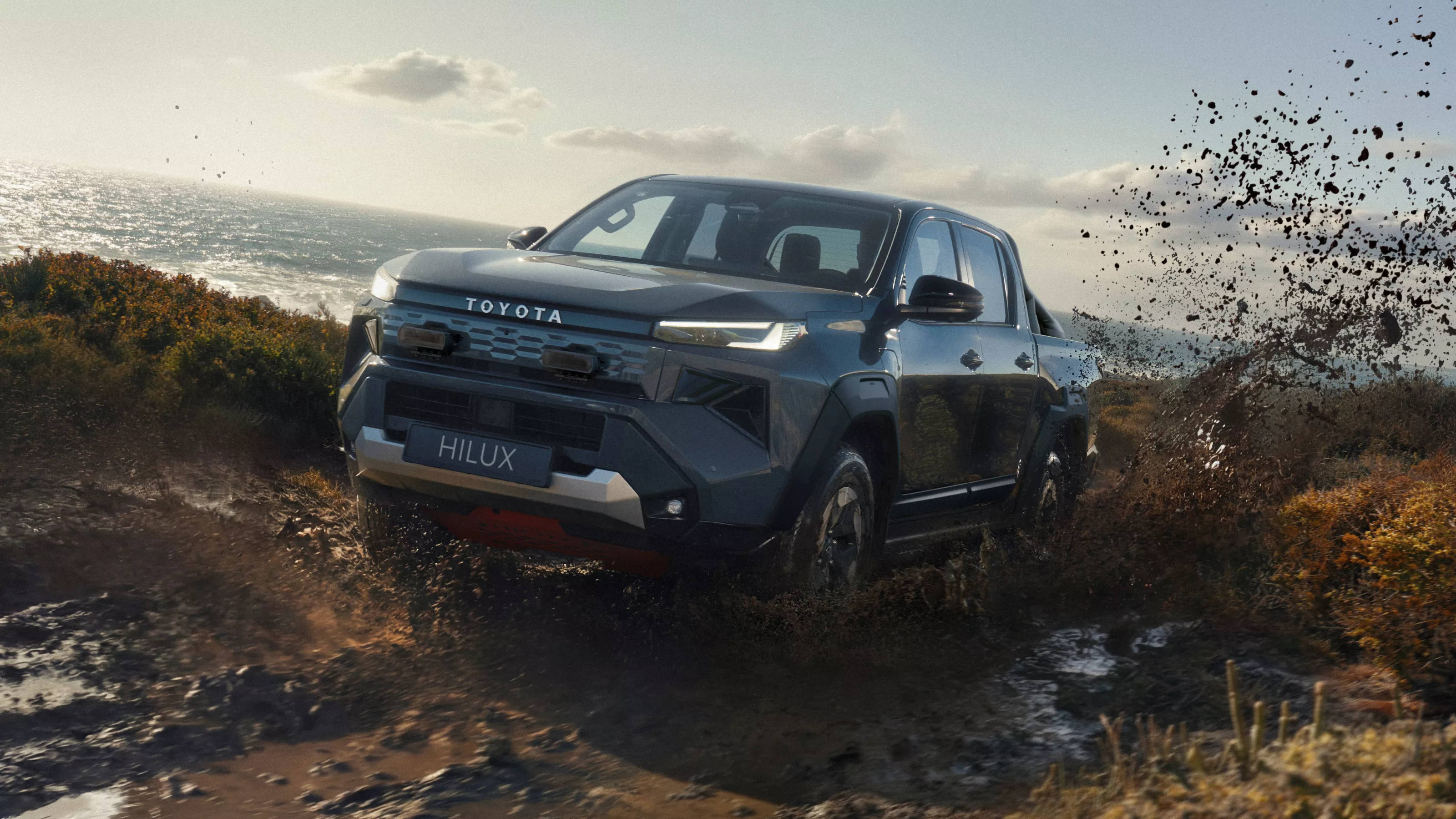 Hilux važiuoja per purvą.